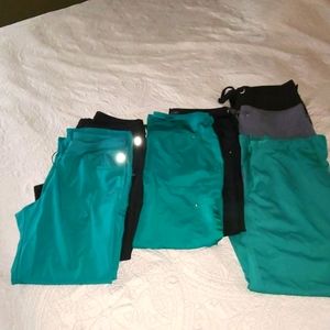 7 pairs of scrub pants and 2 jackets